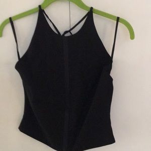 Moda International. Black shell w/satin down the front and ties at the neck.